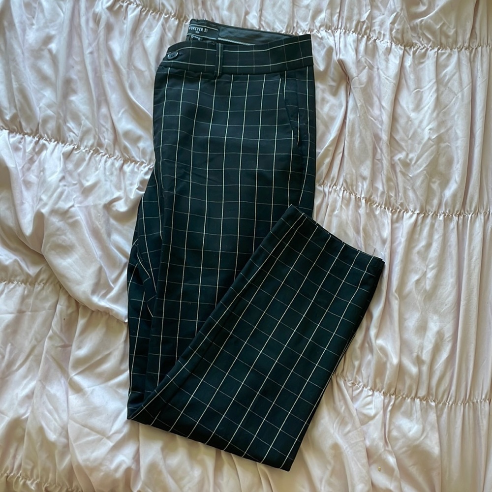 The brand is by Forever 21, it is black with white stripes and its a size 31